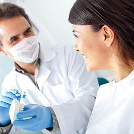 Cosmetic dentist with patient